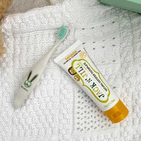 Jack N' Jill, Naturalna pasta do zębów dla dzieci o smaku bananowym bez fluoru, 6m+, 50 g